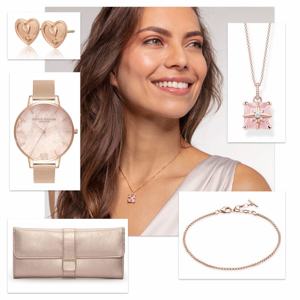 Model wearing Thomas Sabo rose gold pink star with stone necklace. Surrounded by product images of Clogau rose gold heart shaped earrings, Olivia Burton mesh watch, Thomas Sabo bracelet and Wolf jewellery roll.
