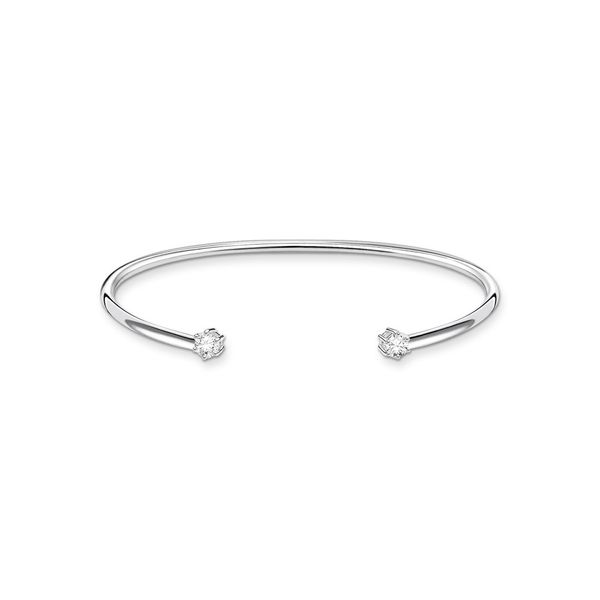 silver open torque bangle with 2 cubic zirconia stones on the ends.