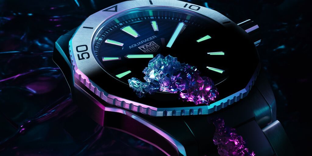 Aquaracer Professional 200 in dark water with the hands glowing to demonstrate the Super-Luminova